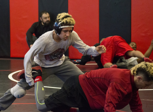 Antonio Saldate, left, spars with Nick Sablan during practice inside the wrestling room at L ...