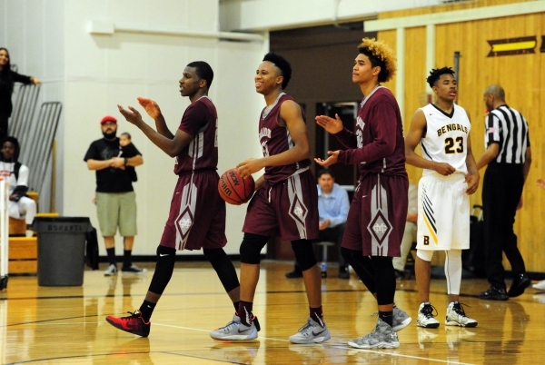 Cimarron-Memorial players celebrate their 51-50 win over Bonanza as time expires in the four ...