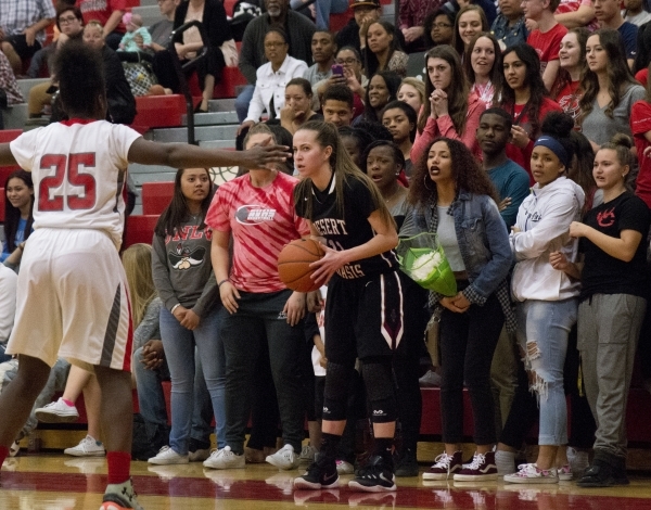 Desert Oasis guard Ashlynn Sharp (11) looks to pass the ball in as Arbor View‘s Alaysi ...