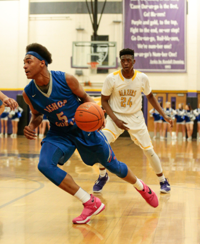 Bishop Gorman junior Charles O‘Bannon (5) makes a break for the basket as Durango juni ...