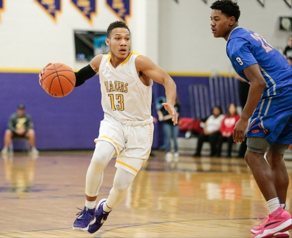 Durango junior Demetrius Valdez (13) makes a fast break with the ball around Bishop Gorman j ...