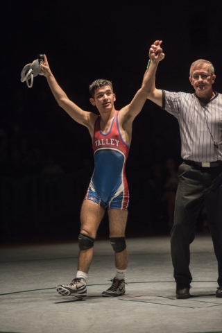 The referee raises Valley‘s Ulises Munguia hand after defeating Green Valley‘s T ...