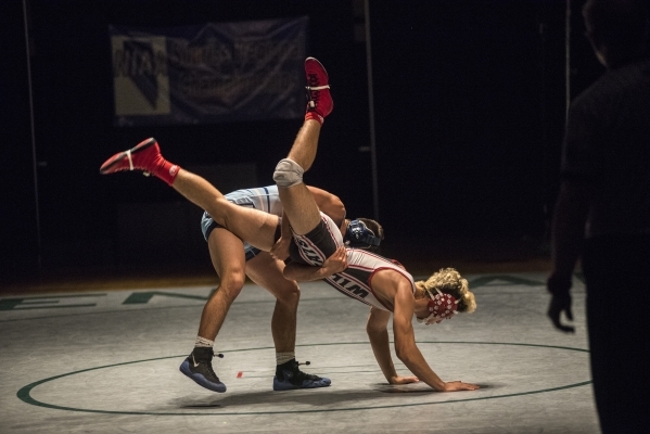 Foothill‘s Jacob Chavez, top, wrestles Las Vegas High‘s Nick Saban during their ...