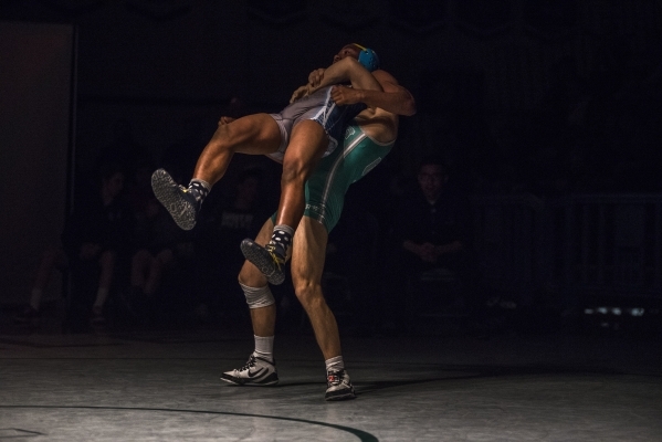 Green Valley‘s Giullian Nakamatsu, bottom, wrestles Canyon Spring WIlliam Stevenson du ...