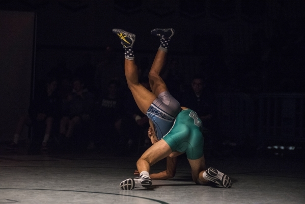 Green Valley‘s Giullian Nakamatsu, bottom, wrestles Canyon Spring WIlliam Stevenson du ...