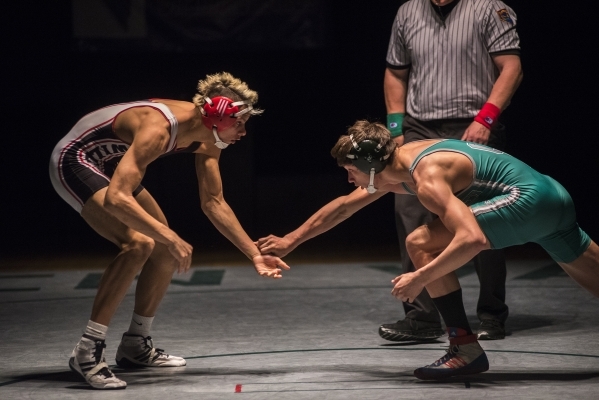 Las Vegas High‘s Andrew Stokes, left, wrestles Green Valley‘s Adrien Ojeda durin ...