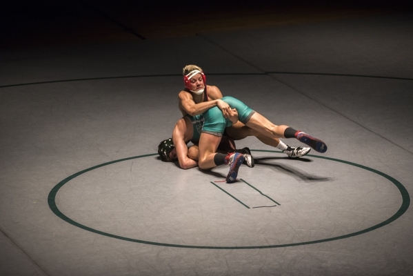 Las Vegas High‘s Andrew Stokes, top, wrestles Green Valley‘s Adrien Ojeda during ...