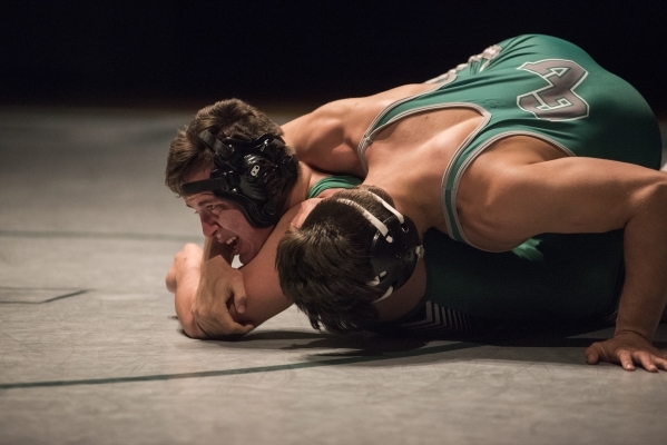 Green Valley‘s Robert Razo, top, wrestles Rancho‘s Alejandro Ordonez during thei ...