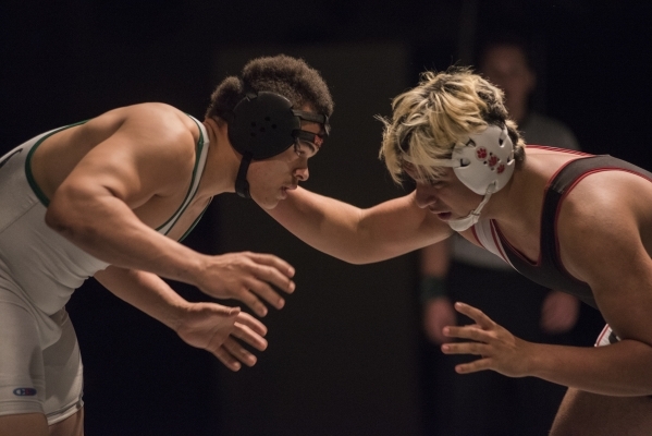 Green Valley‘s Sal Hicks, left, wrestles Las Vegas High‘s Cruz Littlefield durin ...