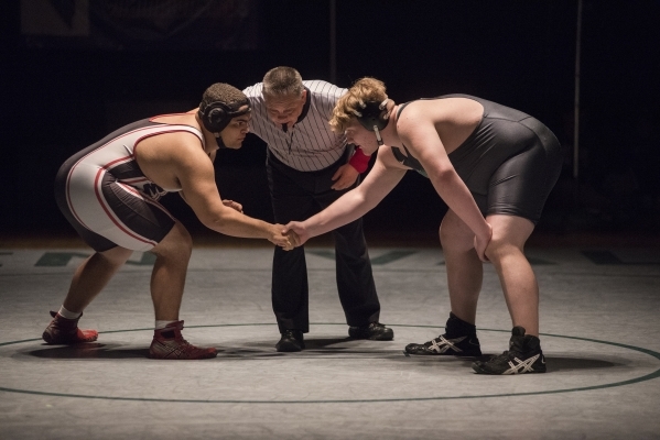 Green Valley‘s Anthony Valenti, right, wrestles Las Vegas High‘s Robby Kaempfer ...