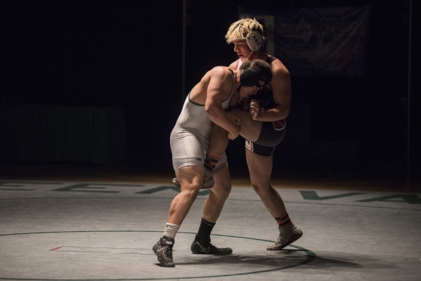 Green Valley‘s Sal Hicks, left, wrestles Las Vegas High‘s Cruz Littlefield durin ...