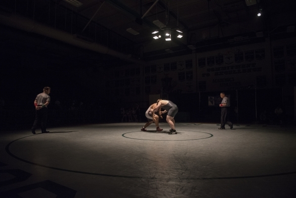 Green Valley‘s Anthony Valenti, right, wrestles Las Vegas High‘s Robby Kaempfer ...