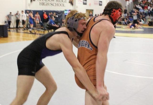 Durango 152 pounder Jacob Bourgault works Legacy‘s Jacob Brents back into the circle, ...