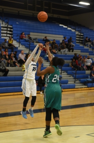 Canyon Springs D‘Licya Feaster (25) goes up for a shot against Rancho‘s Kyndal R ...