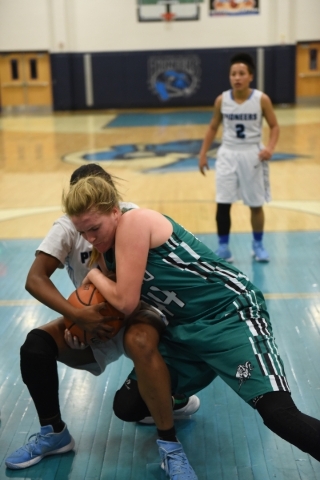 Rancho‘s Samantha Pochop (44) battles for a rebound against Canyon Springs Alexia Thro ...