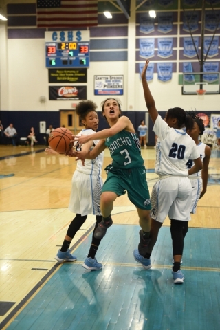 Rancho‘s Maureen Macato (3) goes up for a shot against Canyon Springs Alexia Thrower ( ...