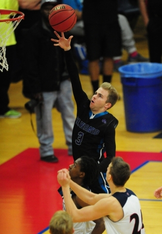 Silverado guards Evan Tafoya (3) goes up for a shot against Coronado in the fourth quarter o ...