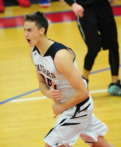 Coronado forward Jake Desjardins (24) reacts after dunking against Silverado in the fourth q ...