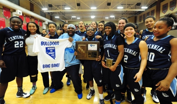 Centennial players celebrate their 71-56 voctory over Bishop Gorman during their prep basket ...