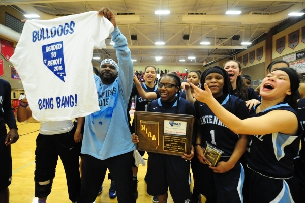 Centennial players celebrate their 71-56 voctory over Bishop Gorman during their prep basket ...