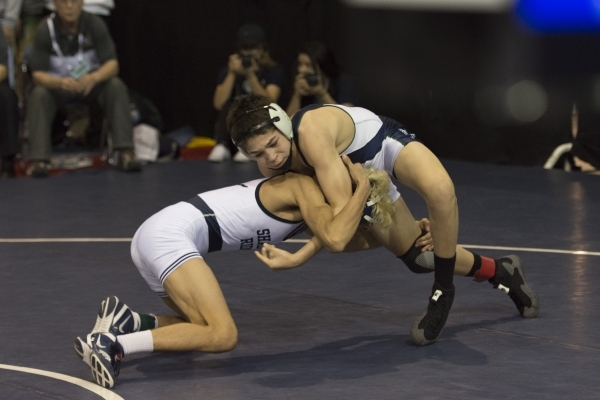 Greg Ewert, right, of Damonte Ranch High School wrestles Francisco Martinez of Shadow Ridge ...