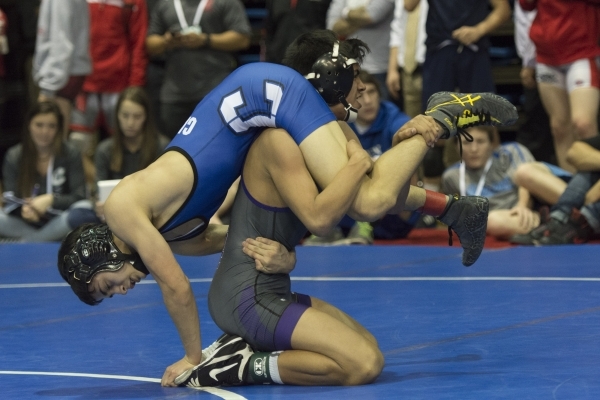 Jacob Ruiz, bottom, of Spanish Springs High School wrestles Brandon Basa of Carson High Scho ...