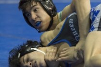 Desmond Bowers, back, of Green Valley High School wrestles David Montes of McQueen High Scho ...