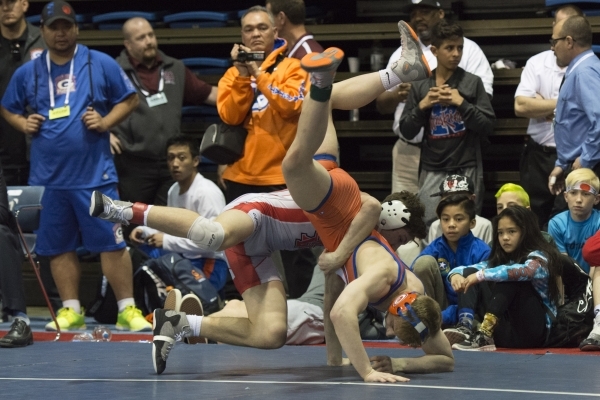 Mason Campbell, foreground, of Bishop Gorman High School wrestles Dawson Downing of Arbor Vi ...