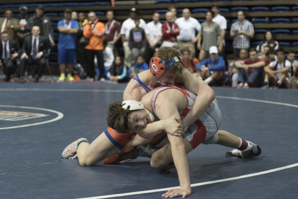 Mason Campbell, back, of Bishop Gorman High School wrestles Dawson Downing of Arbor View Hig ...