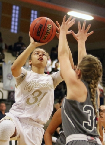 Spring ValleyÂ´s Ella Zanders, left, goes for a layup near Faith LutheranÂ´s Heather Her ...