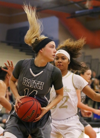 Faith LutheranÂ´s Sam Caruth, left, grabs a rebound near Spring Valley‘s Lynnae Wild ...