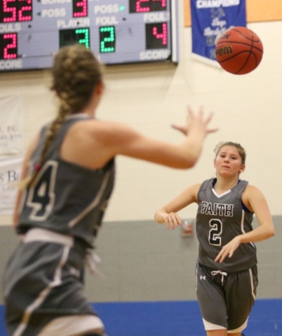 Faith LutheranÂ´s Bobbi Tharaldson, right, passes the ball to Heather Hersh during the NIA ...