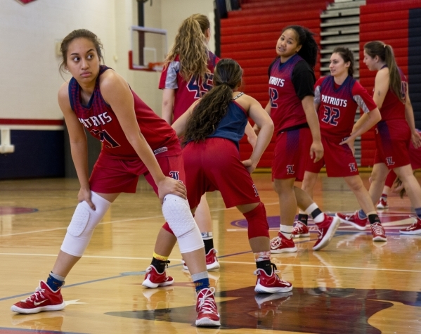 Liberty‘s Kaily Kaimikaua (21) stretches during practice at Liberty High School in Las ...