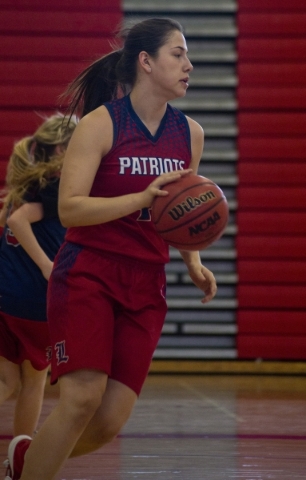 Liberty‘s Nancy Caballero (41) takes the ball up the court court during practice at Li ...