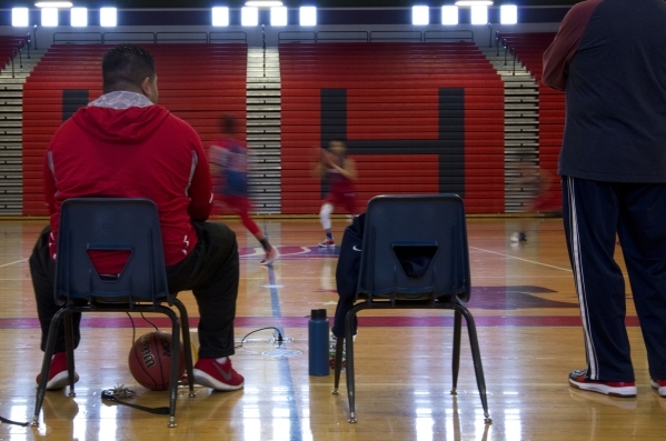 Liberty High School girls basketball coach Chad Kapanui watches his team during practice at ...