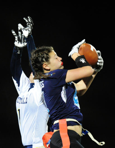 Centennial wide receiver Ashley Marshall catches a pass against Foothill safety Sayonna Thun ...