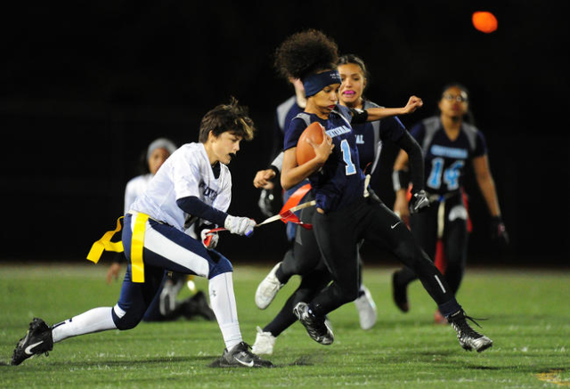 Foothill safety Alexis Farias, left, pulls the flag off of Centennial running back Aliyah Wy ...