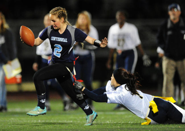 Foothill safety Sayonna Thunstrom, right, pulls the flag off of Centennial Halli Erickson in ...