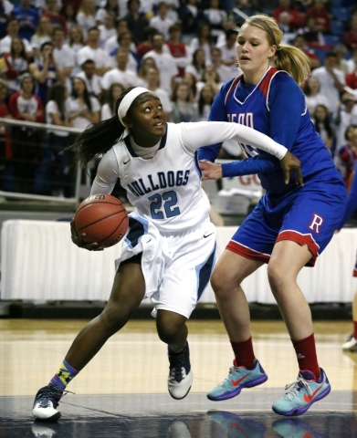 Centennial‘s Eboni Walker looks to shoot against Reno defender Mallory McGwire during ...