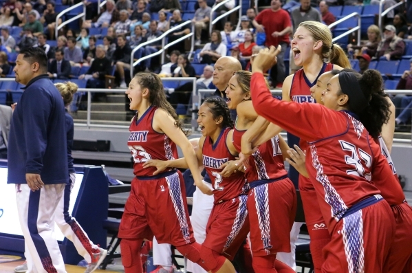 Liberty celebrates a 59-53 victory over Manogue during the NIAA Division I state basketball ...