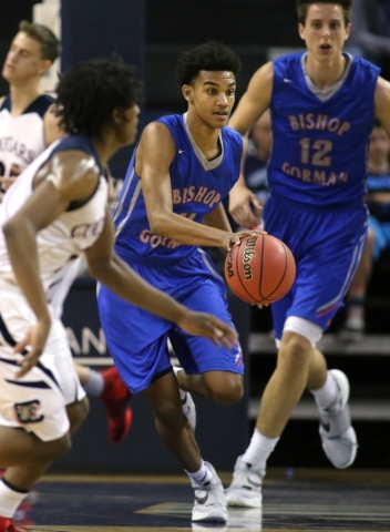 Bishop Gorman‘s Jamal Bey brings the ball up the court in the NIAA Division I state ba ...