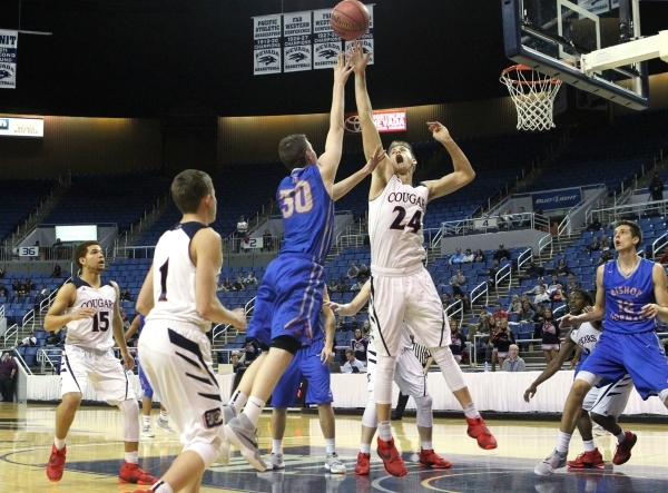 Bishop Gorman‘s Travis Rice shoots over Coronado defender Jake Desjardins during the N ...