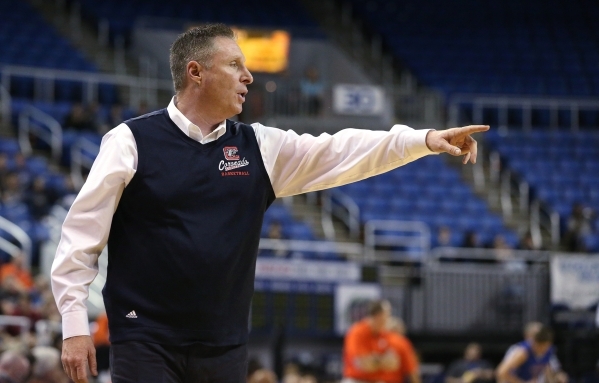 Coronado Head Coach Jeff Kaufman works the sidelines of the NIAA Division I state basketball ...