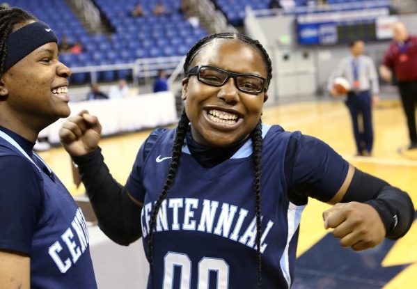 Centennial‘s Pam WIlmore, left, and Tanjanae Wells celebrate their 78-62 victory over ...