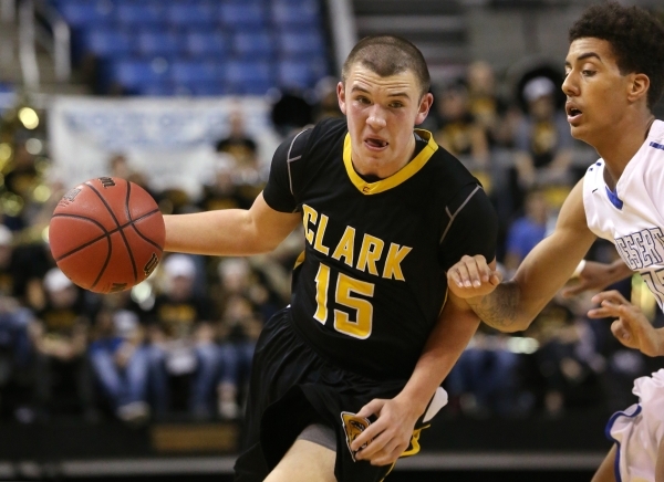 Clark‘s James Bridges drives past Desert Pines‘ Greg Floyd during the NIAA Divis ...