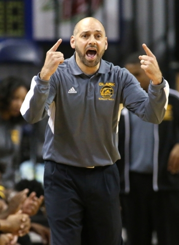 Clark Head Coach Chad Beeten works the sidelines of the NIAA Division I-A state basketball c ...