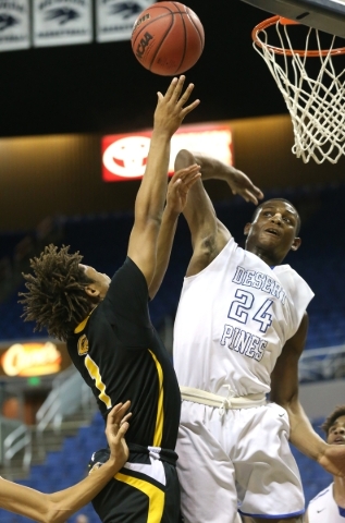 Desert Pines‘ Randal Grimes goes up to block a shot from Clark‘s Keyshaun Webb d ...