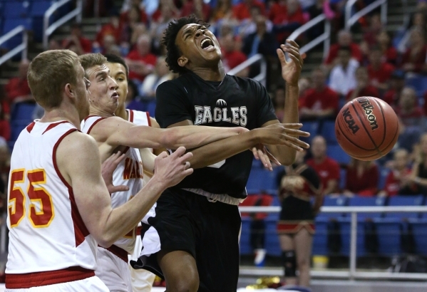 Word of Life‘s Trent McCall gets fouled by Whittell‘s Palmer Chaplin, center, du ...