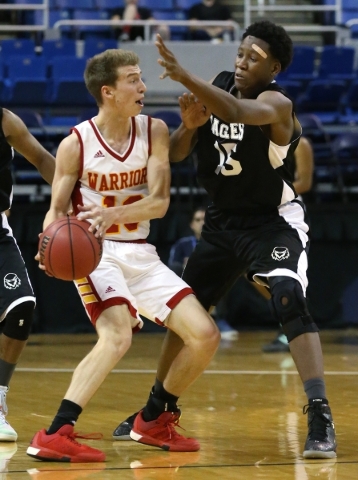 Word of Life‘s Malik Moore pressures Whittell‘s Palmer Chaplin during the NIAA D ...