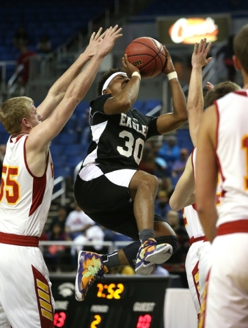 Word of Life‘s Paul Kelker shoots past Whittell defenders during the NIAA Division IV ...